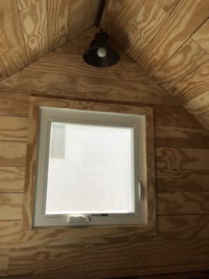 Faux shiplap with plywood. Attic play room. Casement window. Oil rubbed bronze rustic farmhouse light.