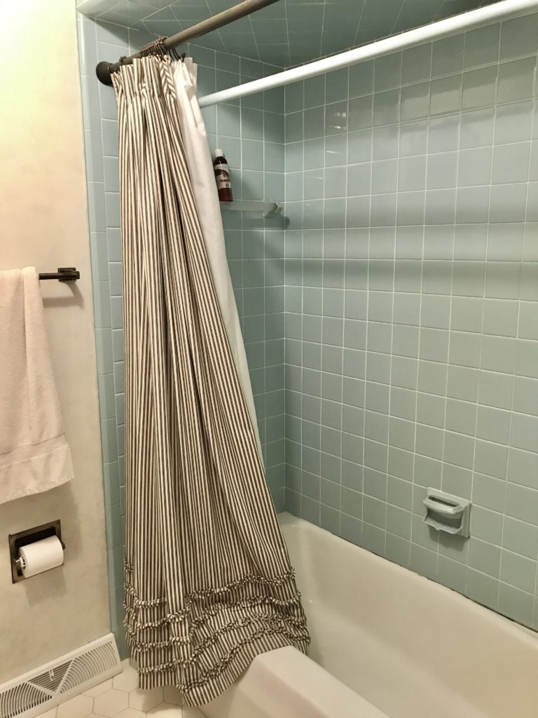blue tile in farmhouse tour before renovations ticking stripe shower curtain