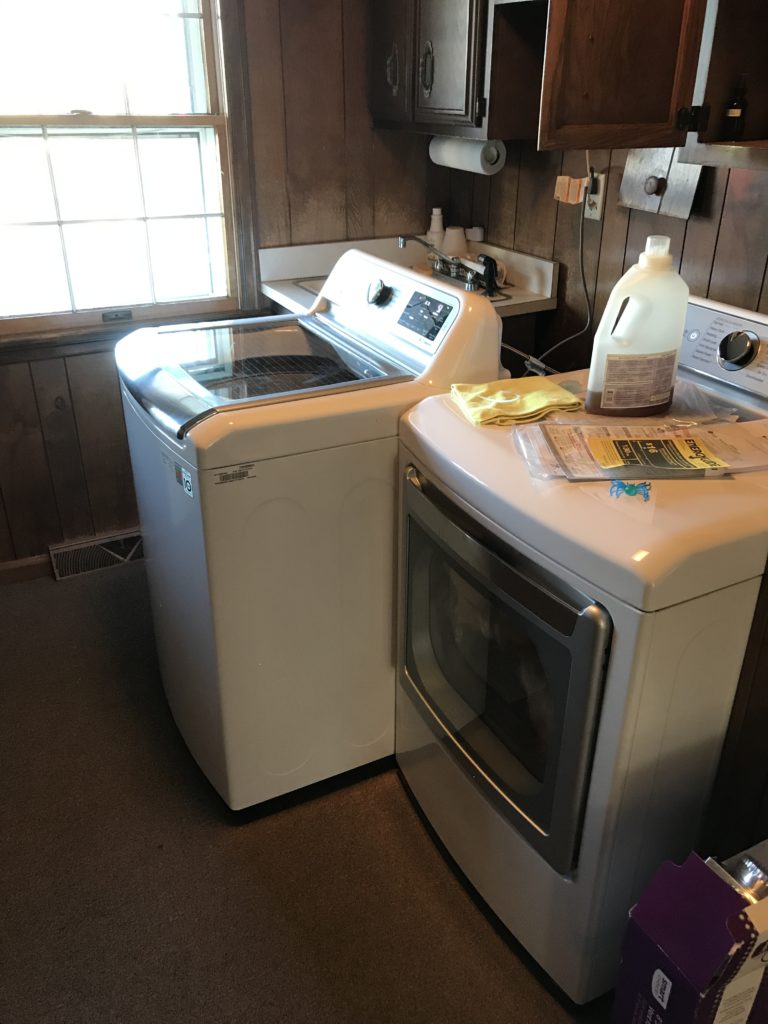 new washer and drying in farmhouse tour before renovations