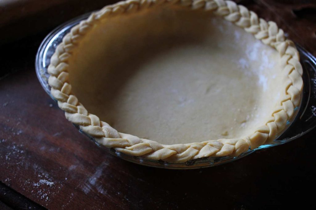 Close up of braided edge of pie crust. 